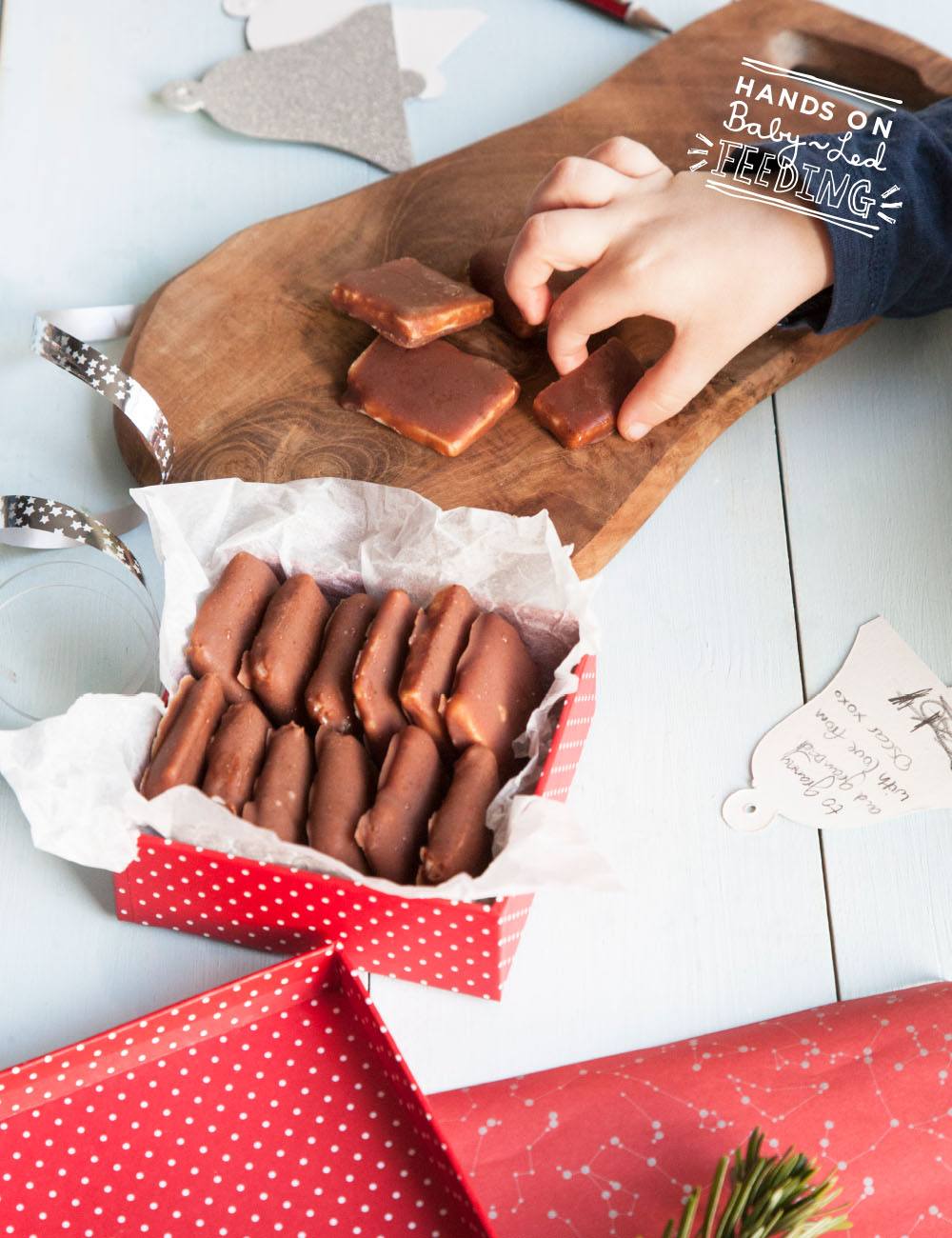 Healthy Wafer Thin Mints, Healthy After Eights Baby Led Feeding Delicious treats perfect for a healthy Christmas baby led weaning. Hand reaching out and grabbing one of the healthy chocolate for baby led weaning recipe for Christmas.