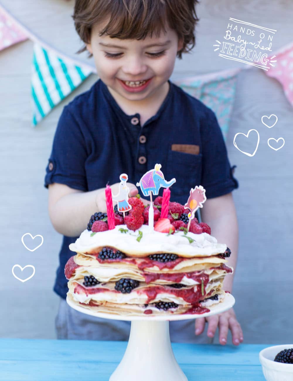 Super cute breakfast for baby led weaning. Home page banner recipe image. Baby Birthday cake from Baby led feeding. Oscars birthday cake for baby led weaning. This pancake cake is staked full of berries, coconut ice cream and raspberry chia jam. Completely refined sugar free blw recipe for baby birthday cake. These pancakes are full of yummy goodness. Packed with nutrients and goodness. From Aileen Cox Blundell Baby Led Feeding Cookbook.