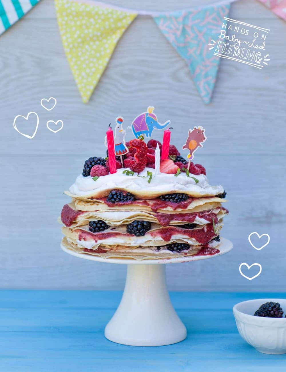 Super cute breakfast for baby led weaning. Full cake image for Oscars birthday breakfast. Baby Birthday cake from Baby led feeding. Oscars birthday cake for baby led weaning. This pancake cake is staked full of berries, coconut ice cream and raspberry chia jam. Completely refined sugar free blw recipe for baby birthday cake. These pancakes are full of yummy goodness. Packed with nutrients and goodness. From Aileen Cox Blundell Baby Led Feeding Cookbook.