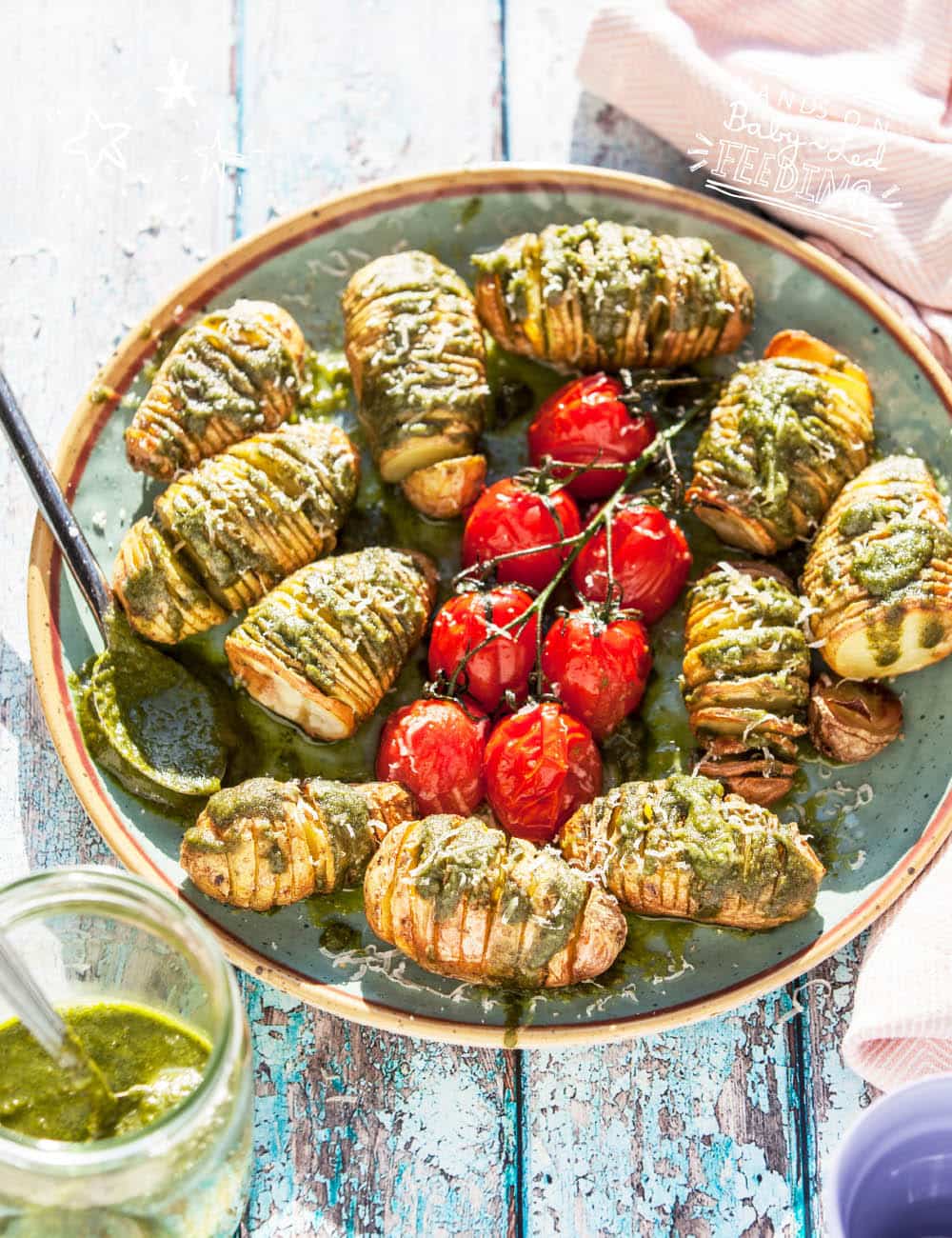 Hasselback Baby Potatoes with Basil and Spinach Pumpkin Seed Pesto easy, quick and amazingly nutritious overhead image of the recipe zoomed into how the potatoes look. A sure winner for fussy kids. One family one dinner recipe.