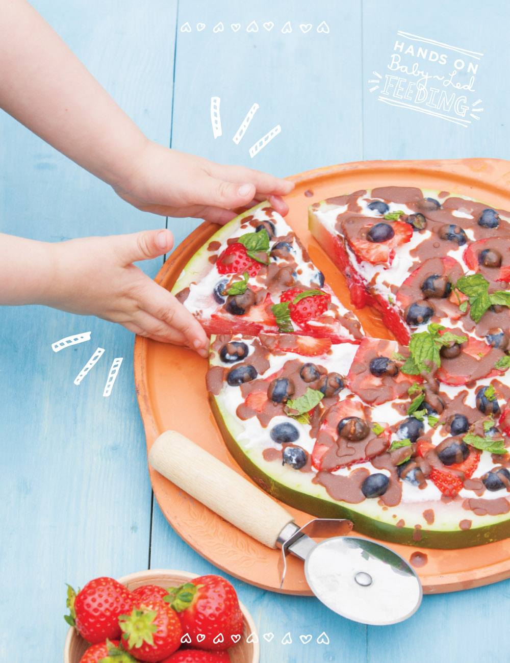 Baby Led Feeding Healthy Watermelon Fruit Pizza. Oscars hand taking pizza. Healthy Summer Family Treats. A deliciously healthy, yummy treat for kids on a hot summers day. This baby led weaning recipe is easy to make and so nutritious, refined sugar free treat packed with goodness. Great for baby led feeding or as a recipe for baby led weaning.