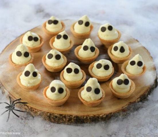 10 Healthy Halloween Foods to make right now! Baby and Toddler Finger Foods Ghostly Mini Cheesecake Bites from Eats Amazing. Homemade Baby Finger Food Recipes and Ideas for giving Your Baby Nutritious Finger Foods for the halloween season. 