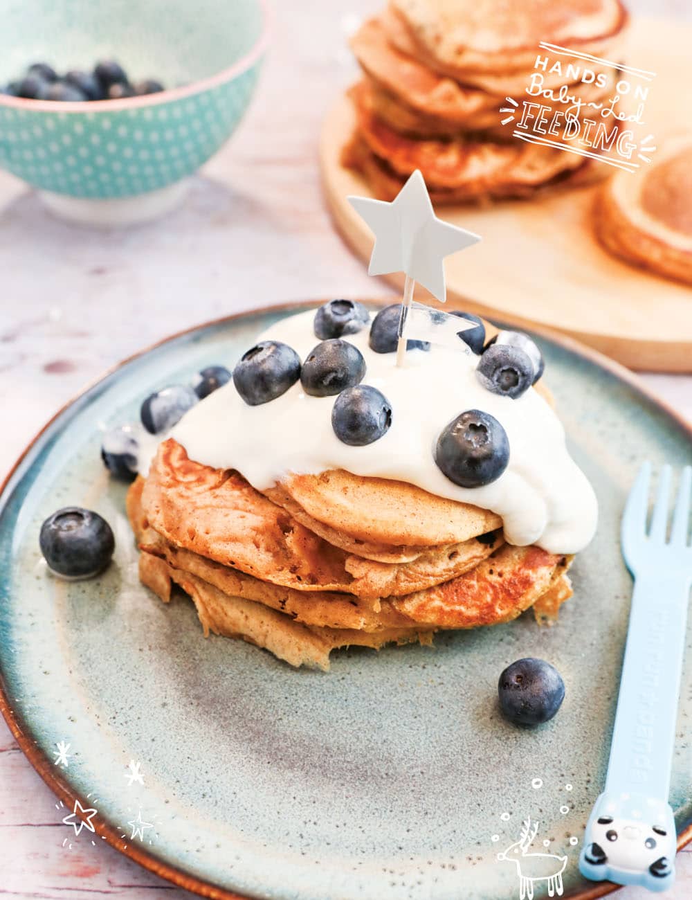 Light and fluffy sweet potato and buttermilk pancakes, spiced with cinnamon and nutmeg, topped with protein packed Greek yogurt and antioxidant rich blueberries. A healthy baby led weaning breakfast. This easy recipe makes a festive Christmas breakfast recipe! #sweetpotato #pancakes #christmasrecipe #holidayrecipe #babyledweaning #babyledfeeding