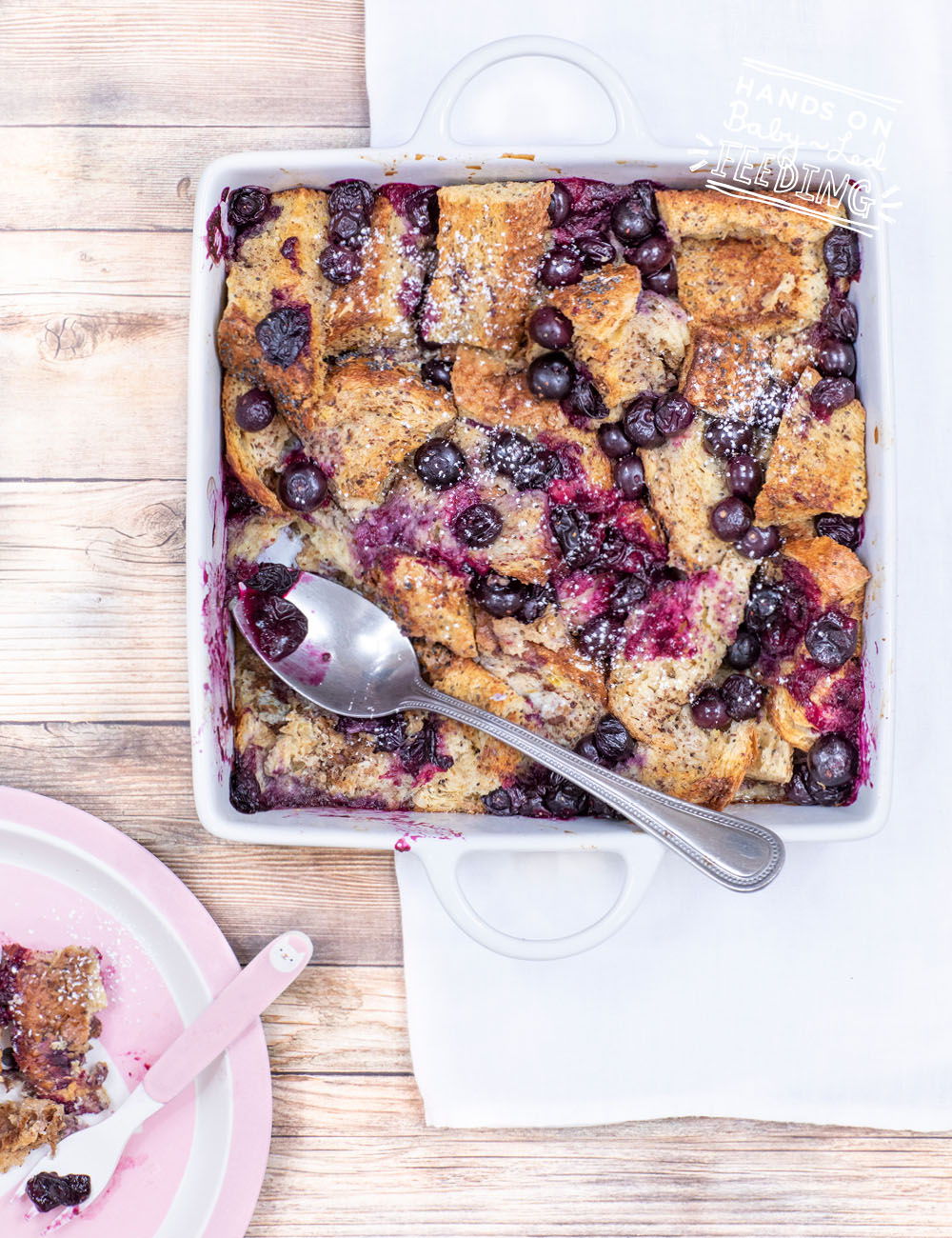 Lemon, Blueberries, and Chi seeds are just a few of the yummy healthy ingredients in this easy refined sugar free french toast bake! Simple step by step images make this baby led weaning recipe easy-to-make. Prepare ahead and bake the next morning for a quick and easy breakfast. #babyledweaning #babyledfeeding #frenchtoast #blueberryrecipe #mealprep