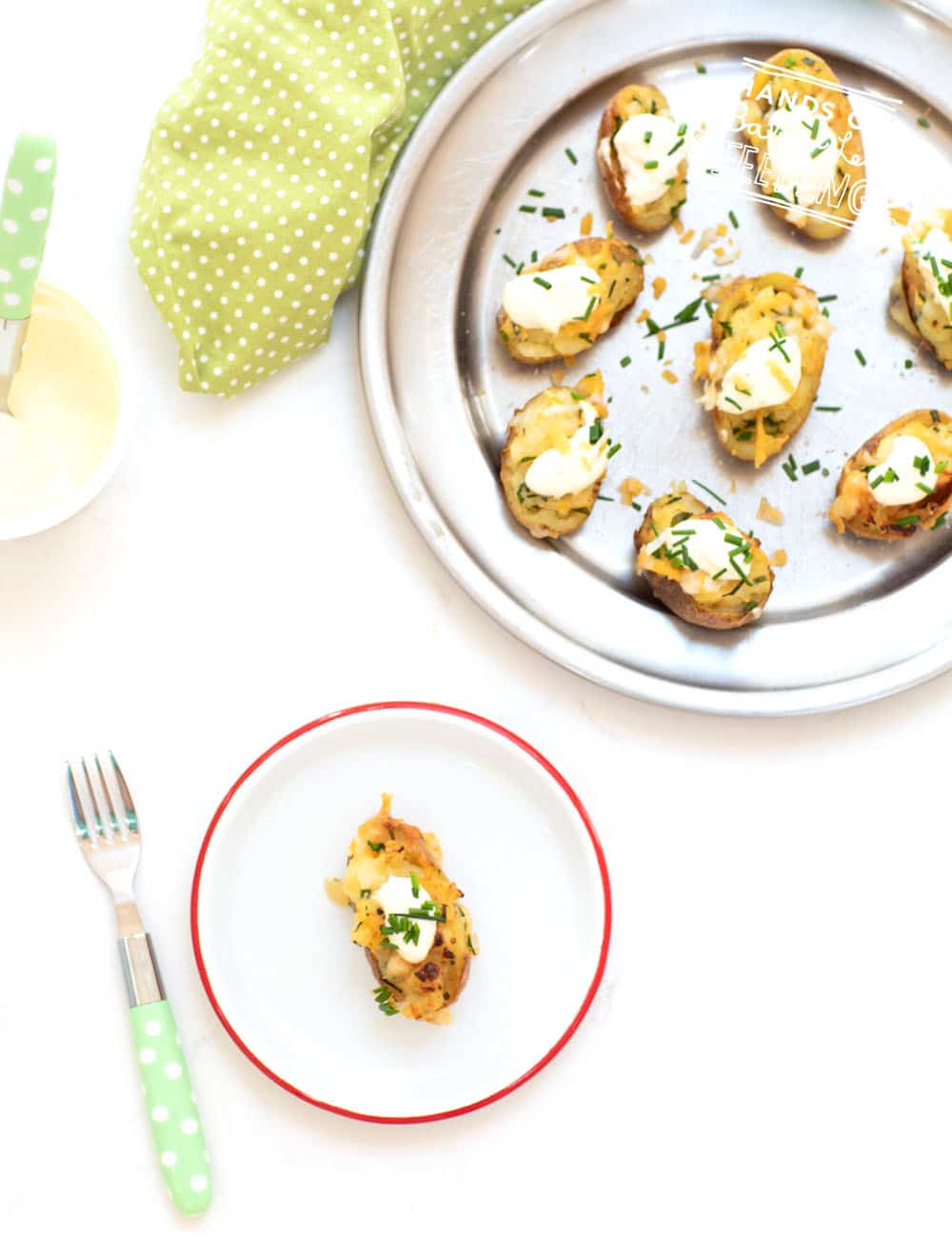 Baby Irish potato bites are an easy appetizer recipe for St. Patrick's Day! Bite sized baby potatoes loaded with a yummy filling topped with a dollop of sour cream or Greek yogurt. #babyledweaning #fingerfood #saintpatricksday #potatoes