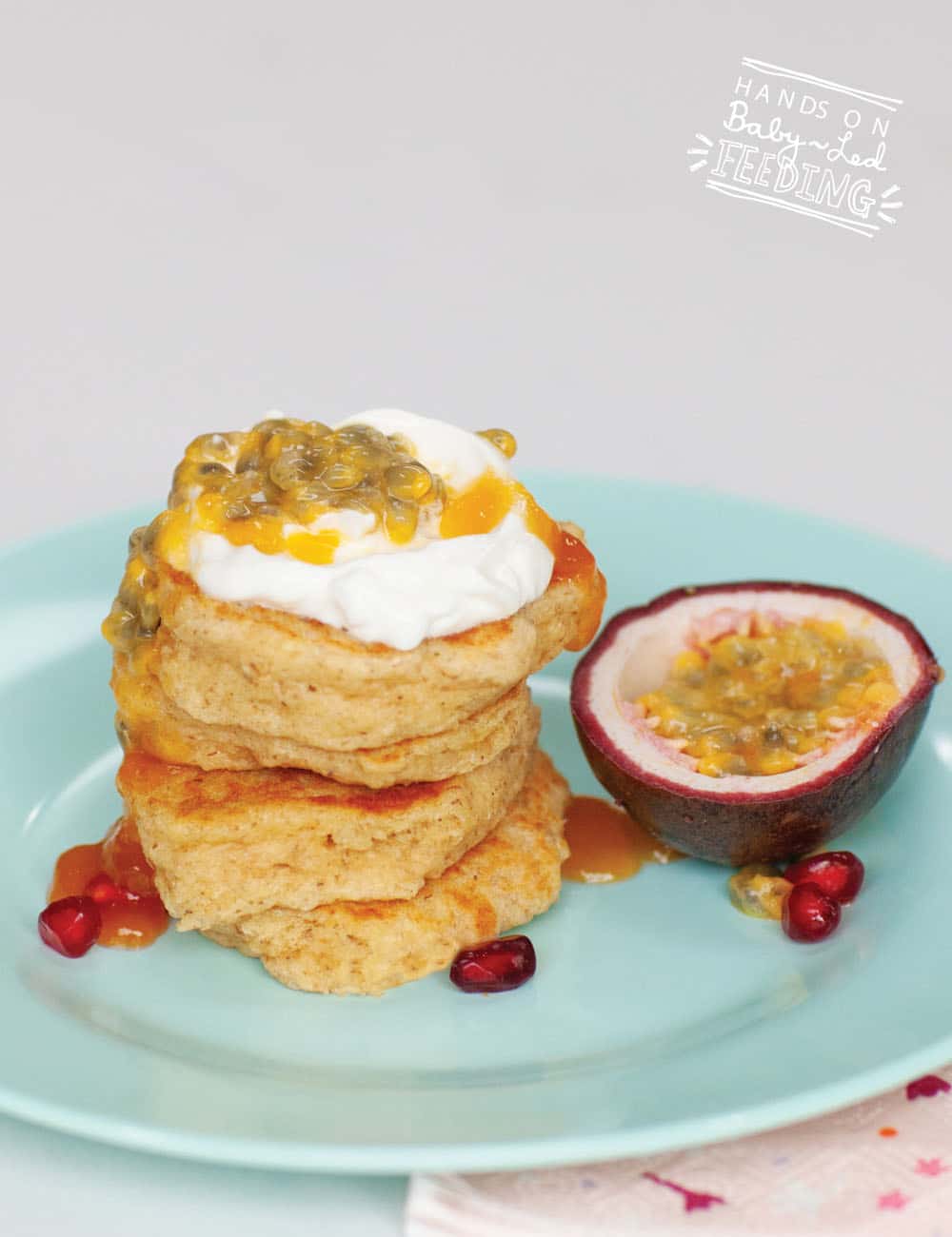 Healthy Oat Pancakes served with protein rich Greek yogurt and fresh sweet passion fruit. These refined sugar free pancakes are high in fiber and protein. Pancakes are my favorite finger food because I can make ahead and freeze them for busy days. #breakfast #babyledweaning #toddlerfood #refinedsugarfree #fingerfood