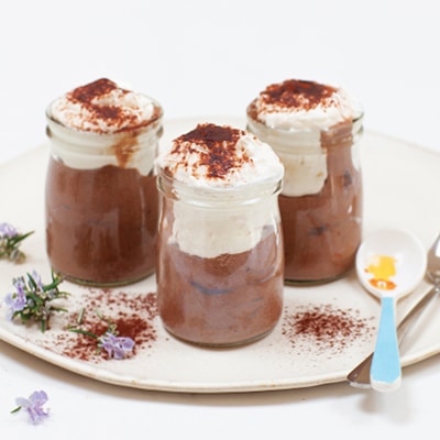 3 glasses full of chocolate avocado mousse and yogurt topping