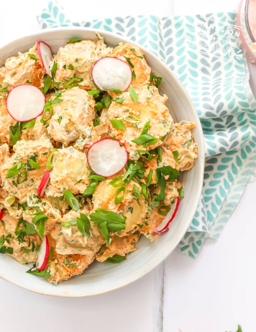 Easy baby led weaning side dish that is perfect to make ahead and super for a summer side dish. No mayo potato salad is made with healthy yogurt and seasoned with spring onions, lemons, apple cider vinegar and topped with zesty radishes. #healthysides #babyledweaning #potatosalad #makeahead #babyledfeeding #toddlerfood 