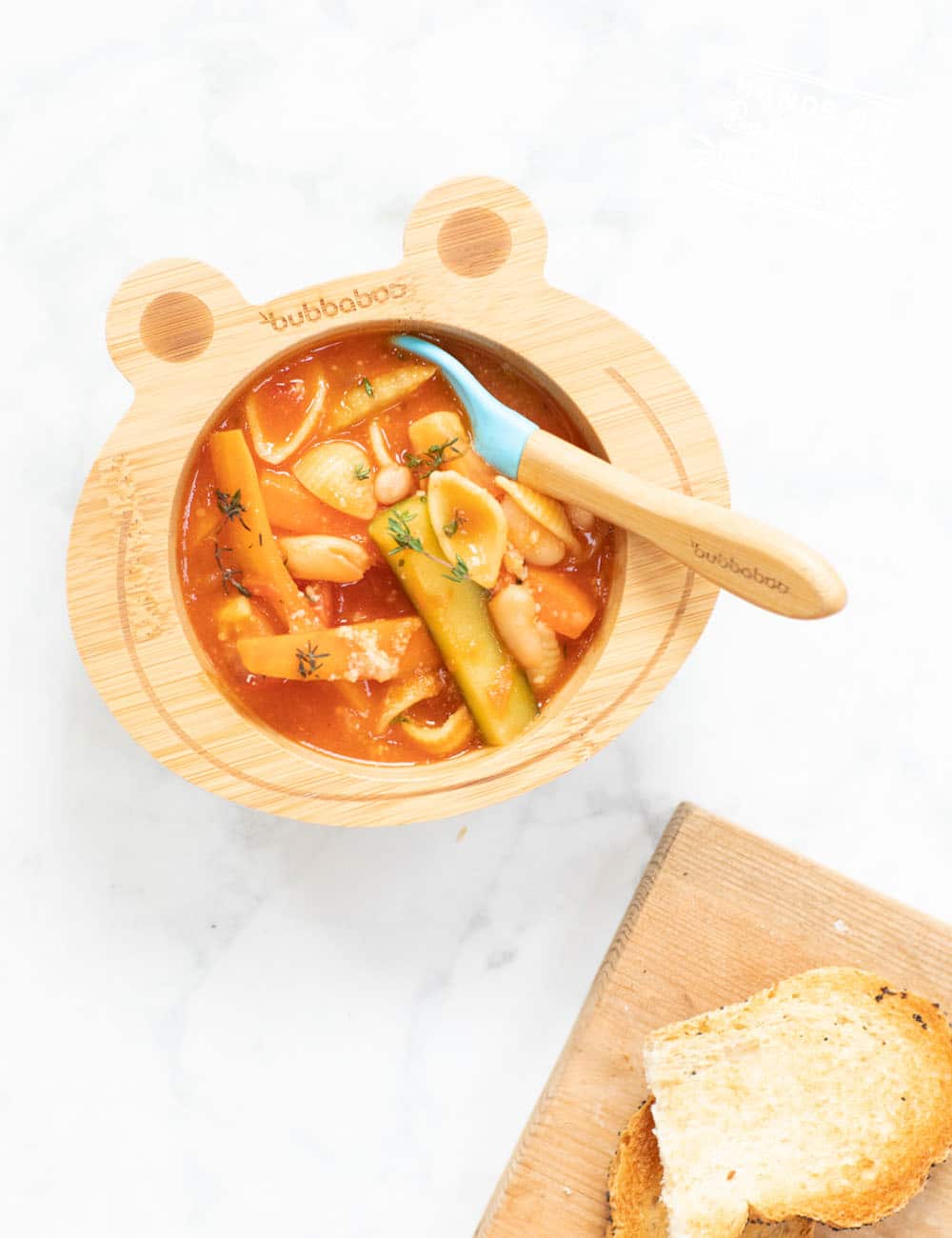 Warm Baby Led Weaning friendly veggie minestrone soup. Cutting veggies correctly for babies is the key to making this soup baby friendly! #soup #babyledweaning #vegan #vegetarian