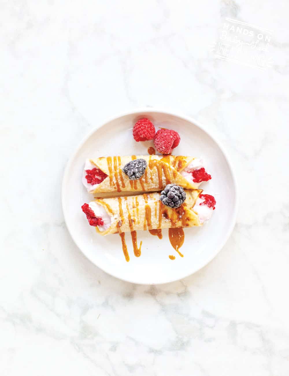 Ideas for baby breakfast! Pancake Tuesday Berry Yoghurt Baby Crepes! Sweetened naturally with fruit and wrapped in a SUPER easy crepe recipe with only 3 ingredients! Refined sugar-free breakfast or treat for babies. #babyledfeeding #babyledweaning #babybreakfast #babybreakfastideas #crepes #pancaketuesday