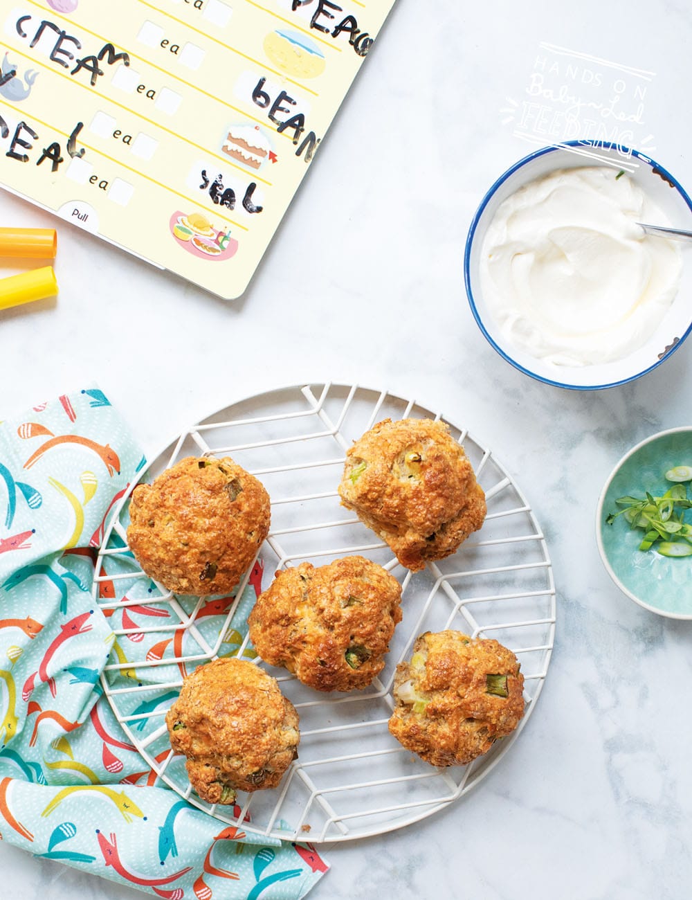 Savory snack for toddlers and babies! These savory scones are an amazing lunchbox idea and travel snack for kids! Scones are the perfect texture and size for little hands. Pack this savory finger food for your next adventure! #babyledfeeding #babyledweaning #scones #fingerfood #savorysnacks