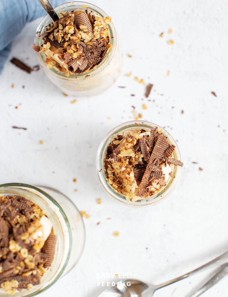 Sugar free overnight oats served with granola, grated chocolate and a light sprinkle of coconut.