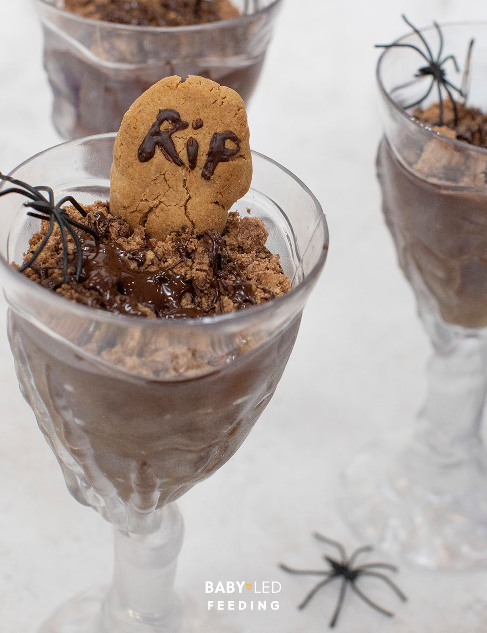 Close up of chocolate mousse pots. Fun Halloween party food.